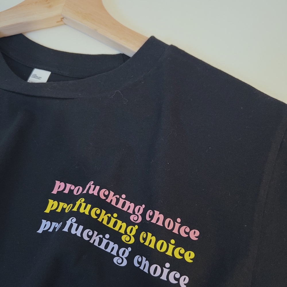 Pro Choice cropped black T shirt pink purple and yellow logo